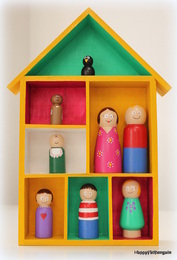 wooden house with wooden family hand painted