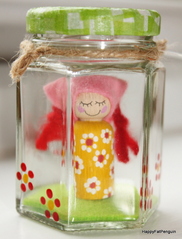 hand painted wooden girl in glass jar
